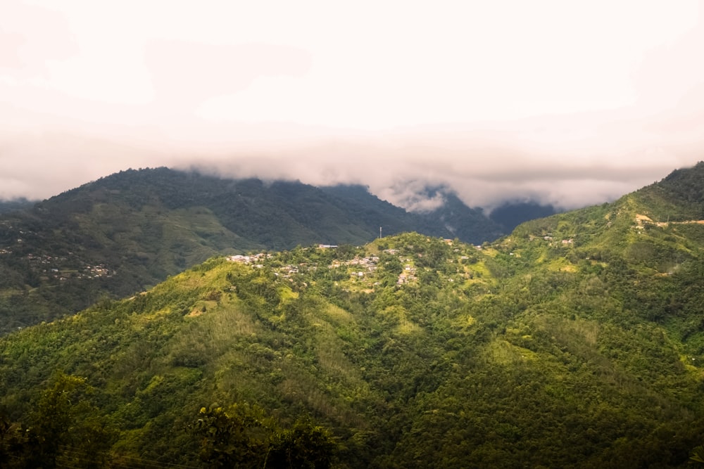 a view of a mountain range with a town in the distance