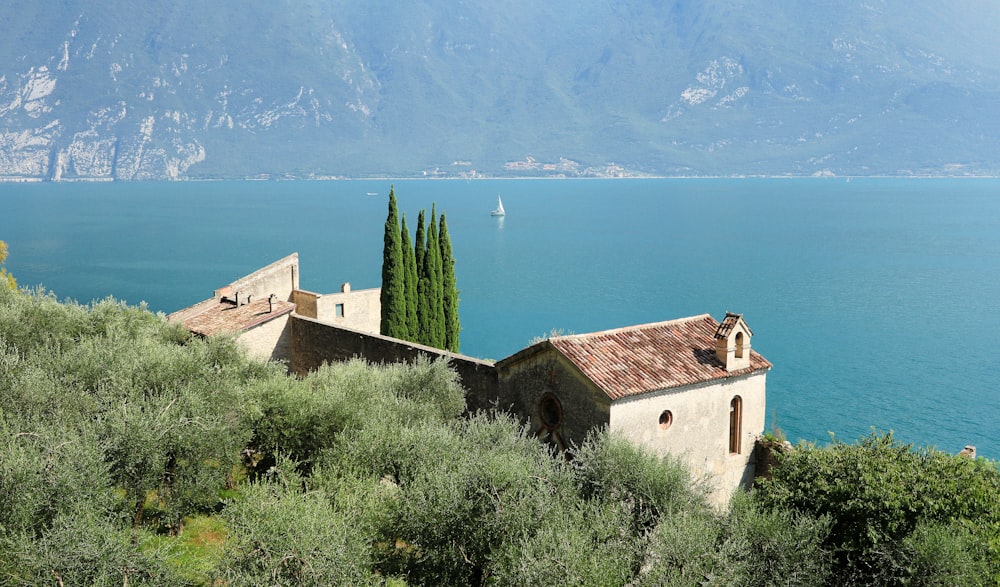 a house on a hill overlooking a body of water