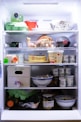 an open refrigerator filled with lots of food