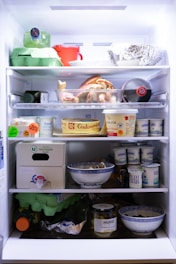 an open refrigerator filled with lots of food
