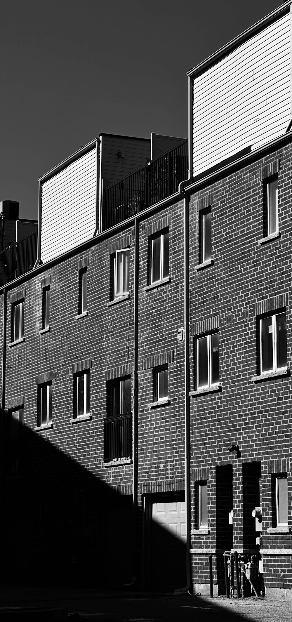 a black and white photo of a brick building