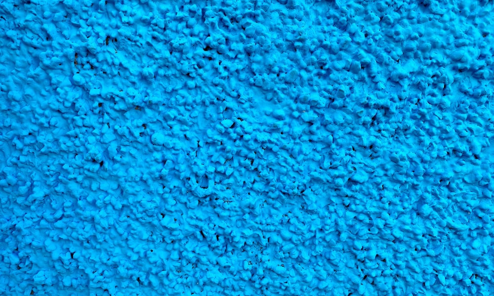 un primo piano di una trama di tappeto blu