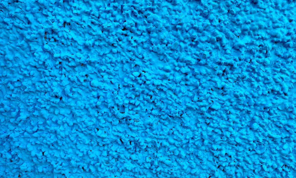 a close up of a blue carpet texture