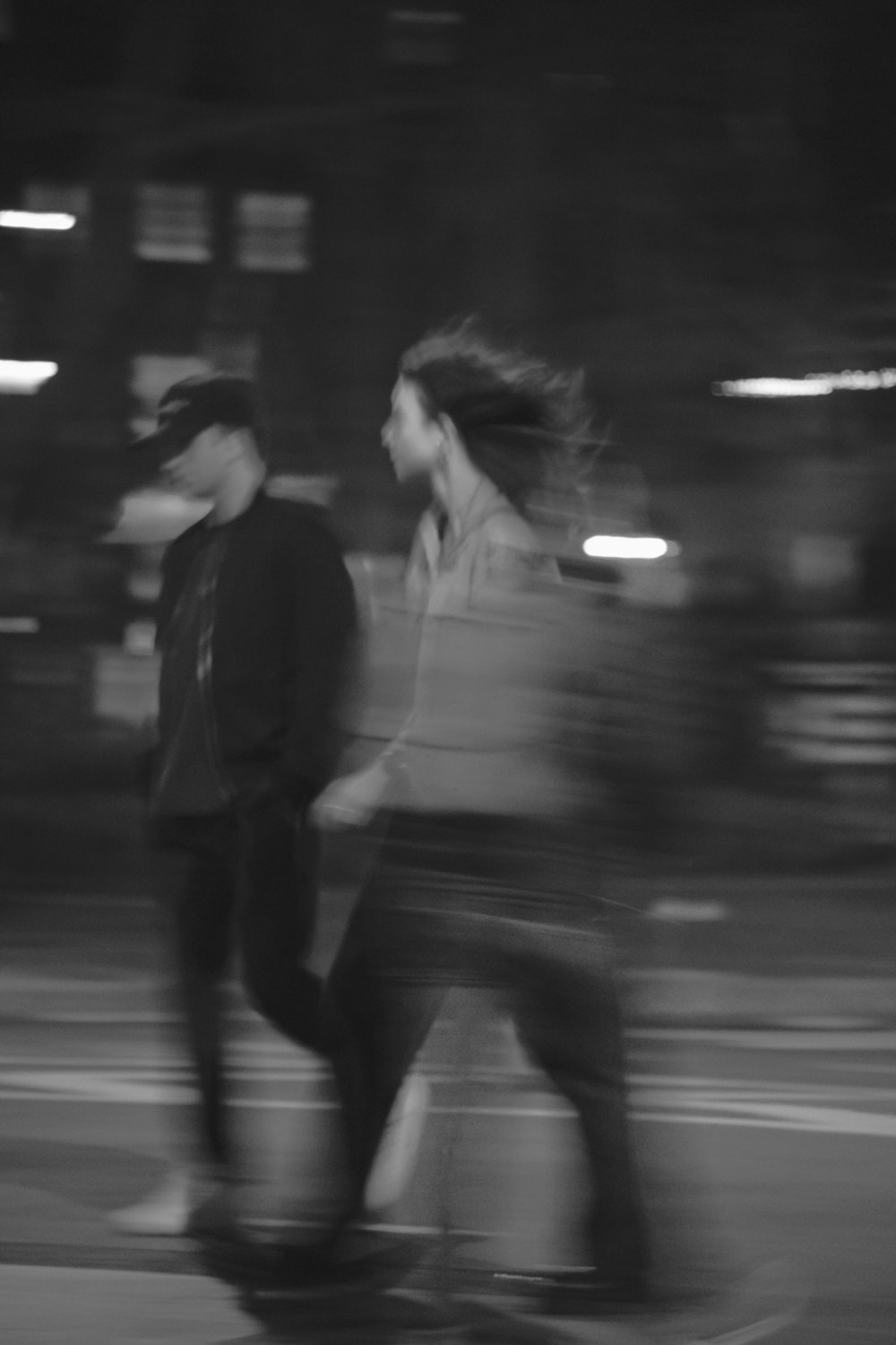 a blurry photo of two people on a skateboard