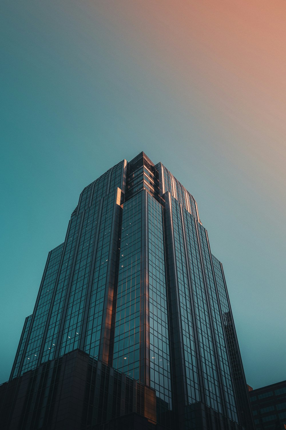 a very tall building with a sky background