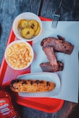a tray of food that includes corn, macaroni and cheese