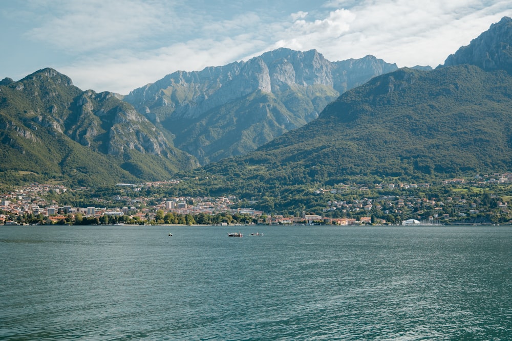 a large body of water with mountains in the background