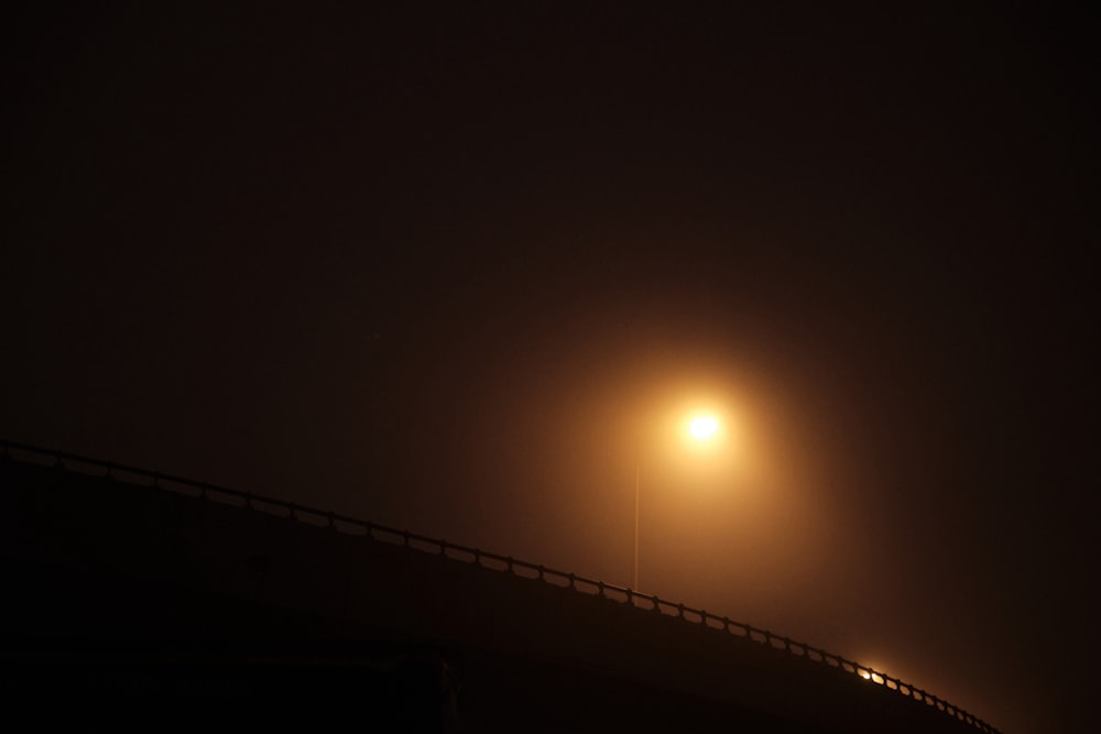 a street light on a foggy night