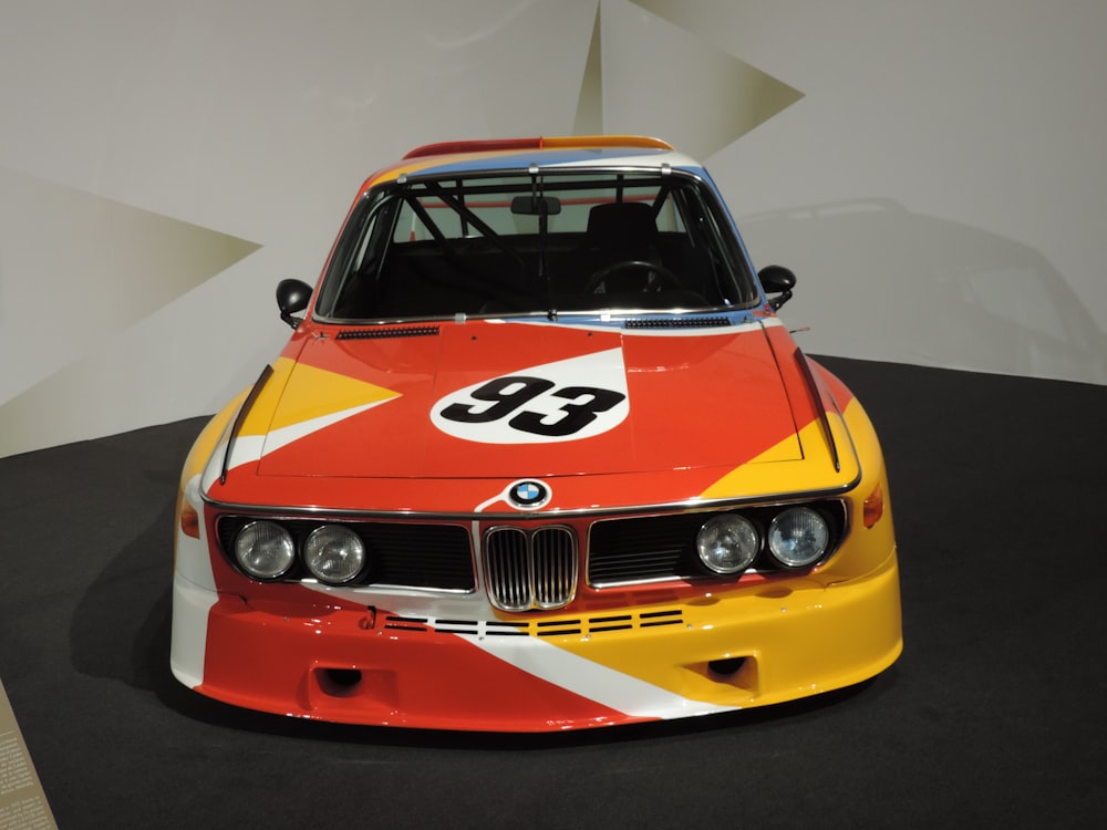 a bmw race car is on display in a museum