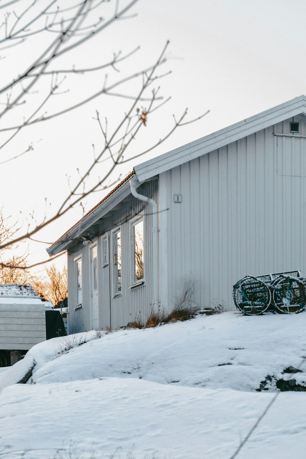 a house with a snowboard on the roof of it