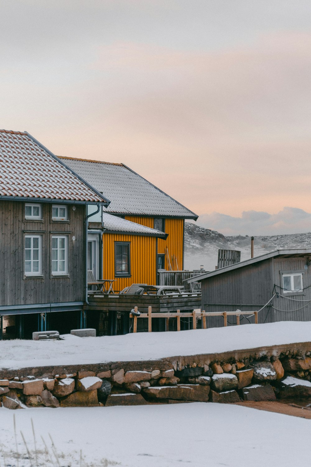 a couple of houses that are in the snow