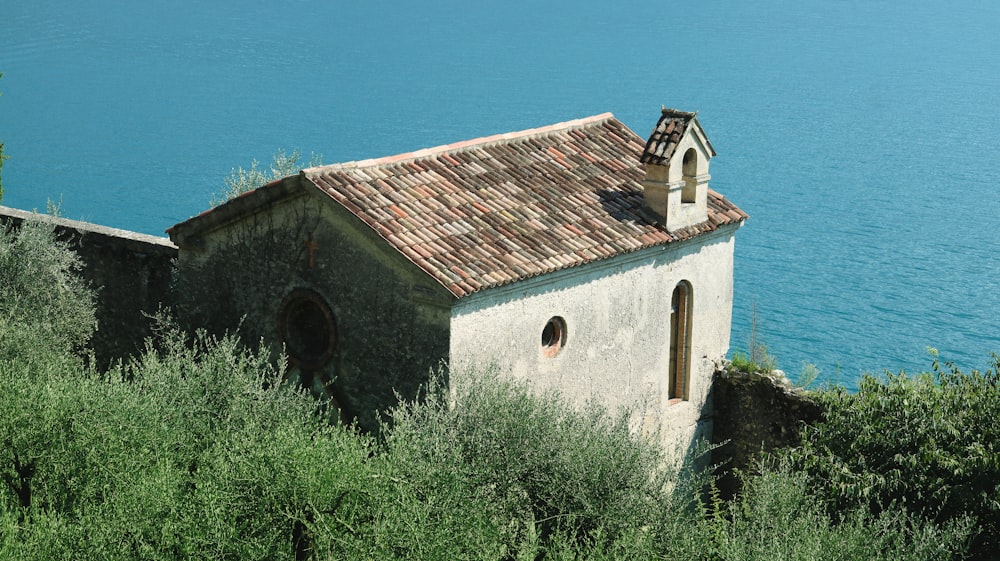 an old church on a cliff overlooking the ocean
