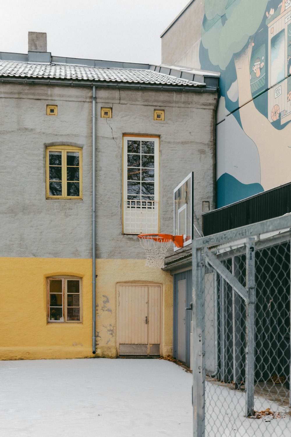 a building with a basketball hoop in front of it