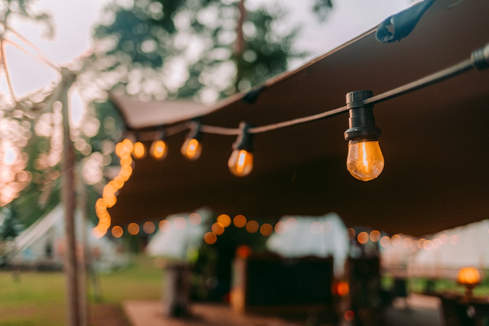 a group of lights that are hanging from a tent