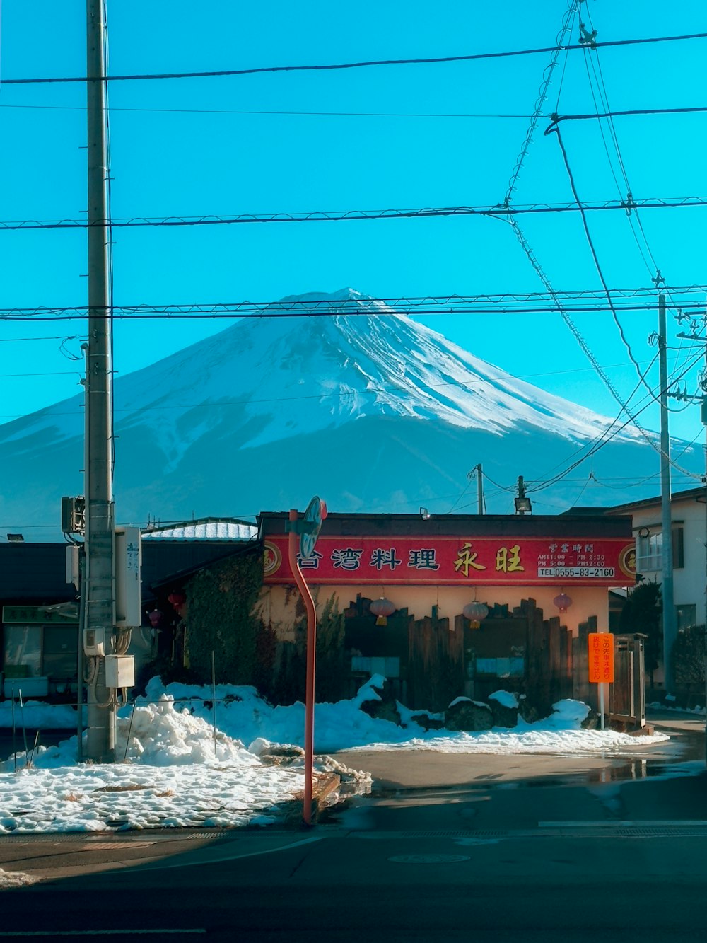 a building with a mountain in the background