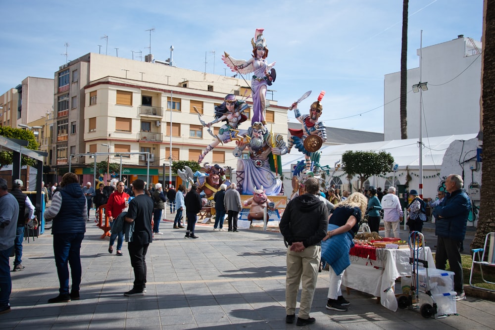 a group of people standing around a street