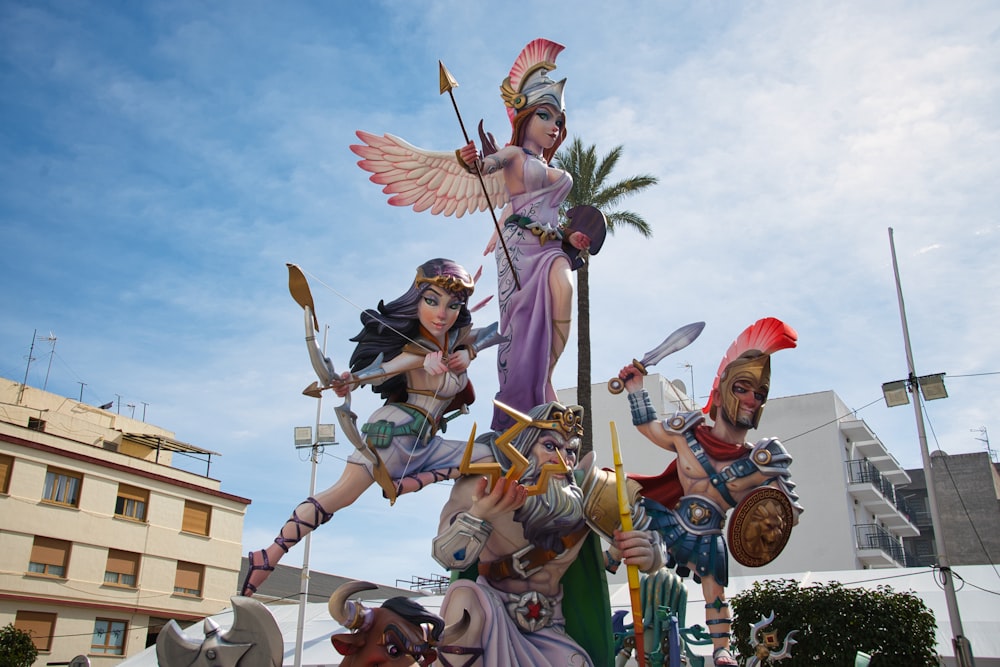 a statue of a woman holding two swords