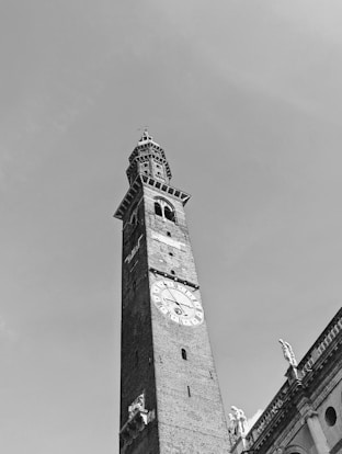 a tall clock tower towering over a city