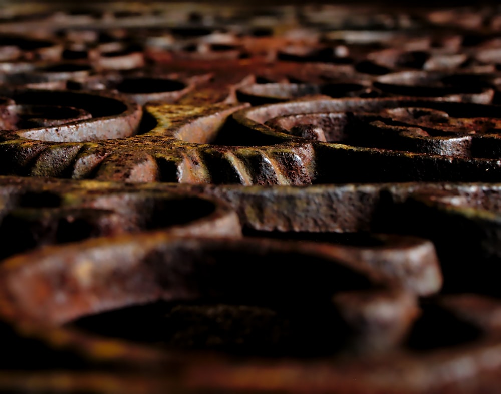 a close up of rusted metal rings on a table