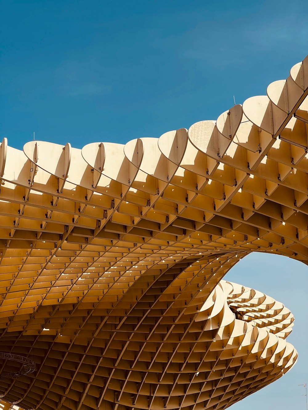 a very large structure with a sky in the background