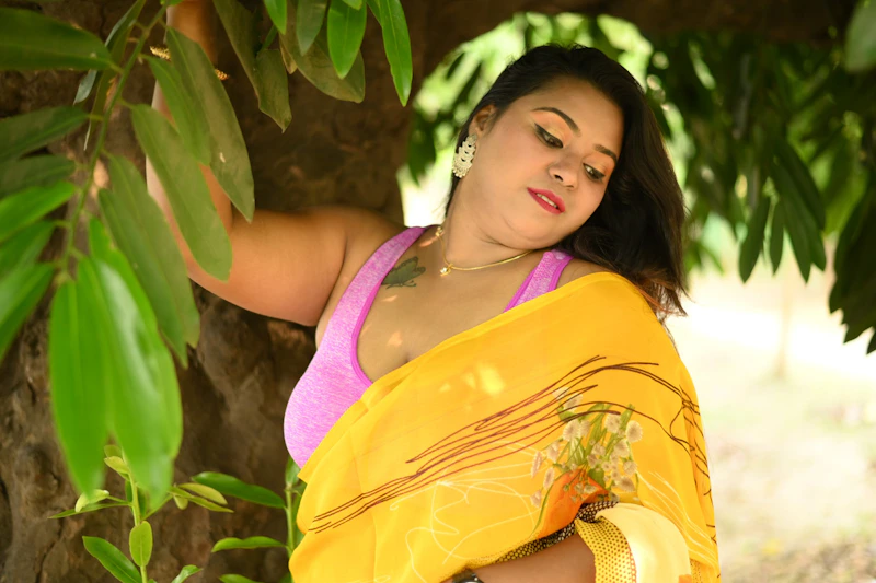 Elegant Indian woman, potential sugar momma, in a yellow sari