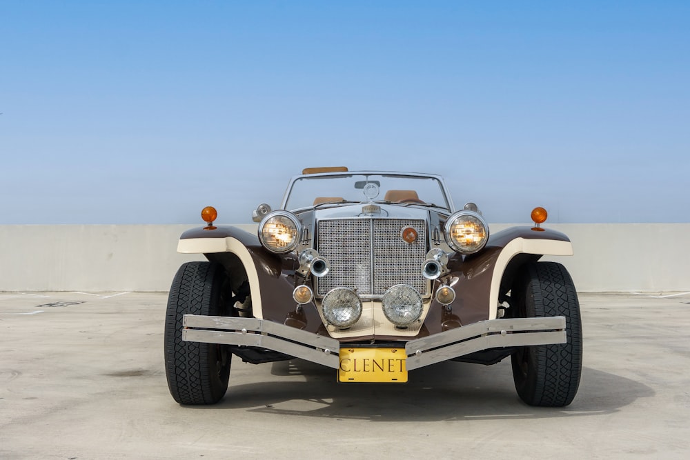 a vintage car is parked in a parking lot