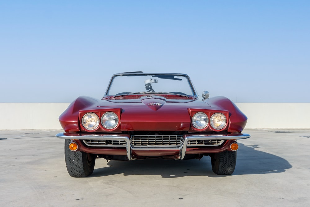 a red sports car parked in a parking lot