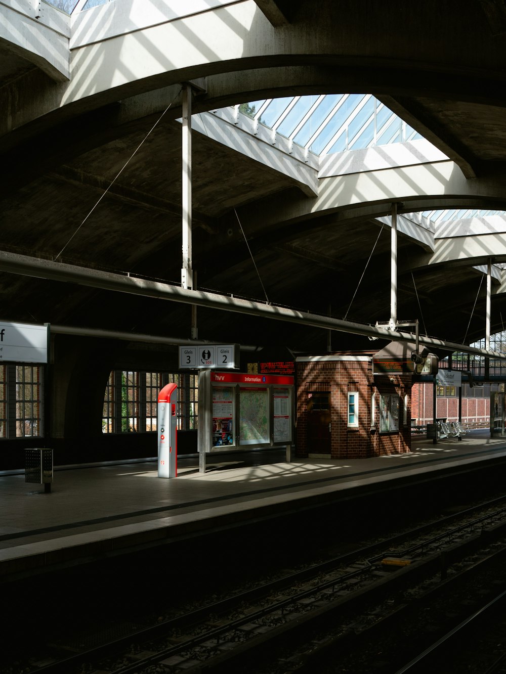 a train station with a train on the tracks