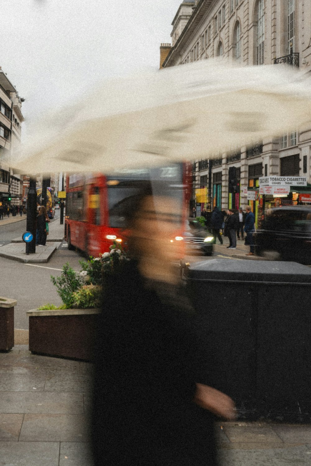 a blurry photo of a person holding an umbrella