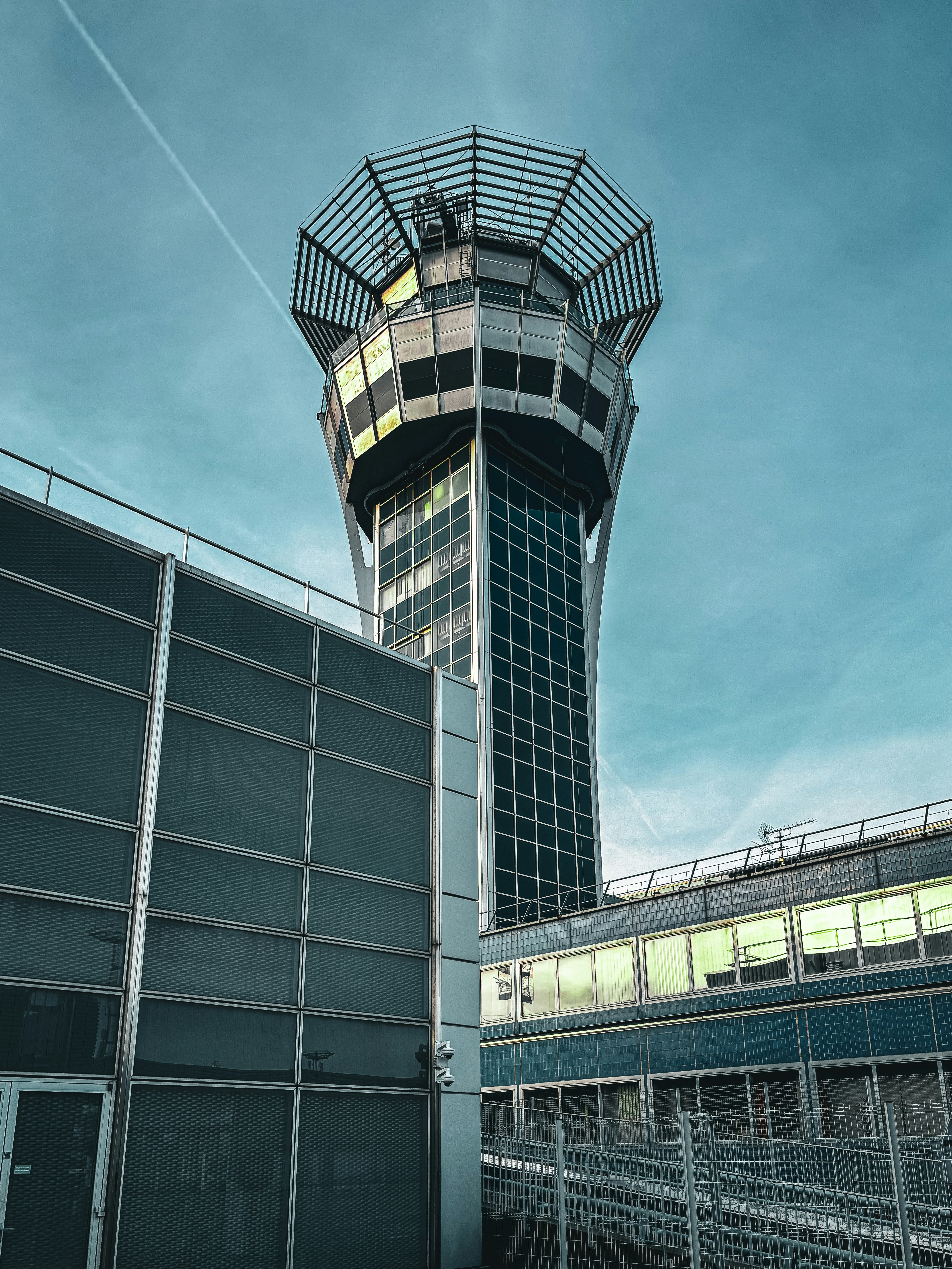 an airport with a control tower in the background