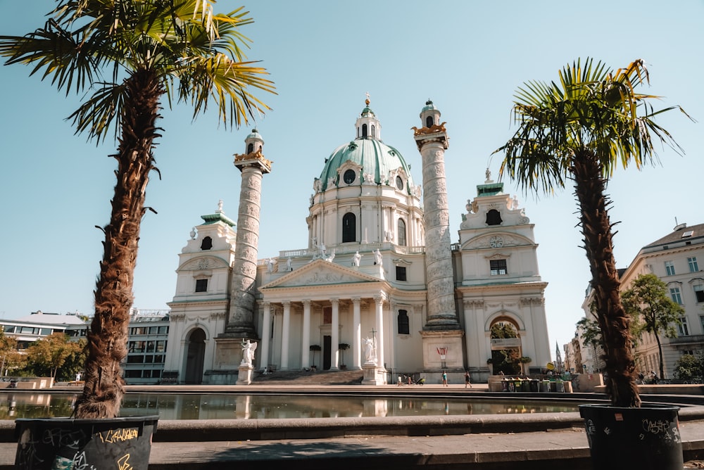 a large white building with a green dome