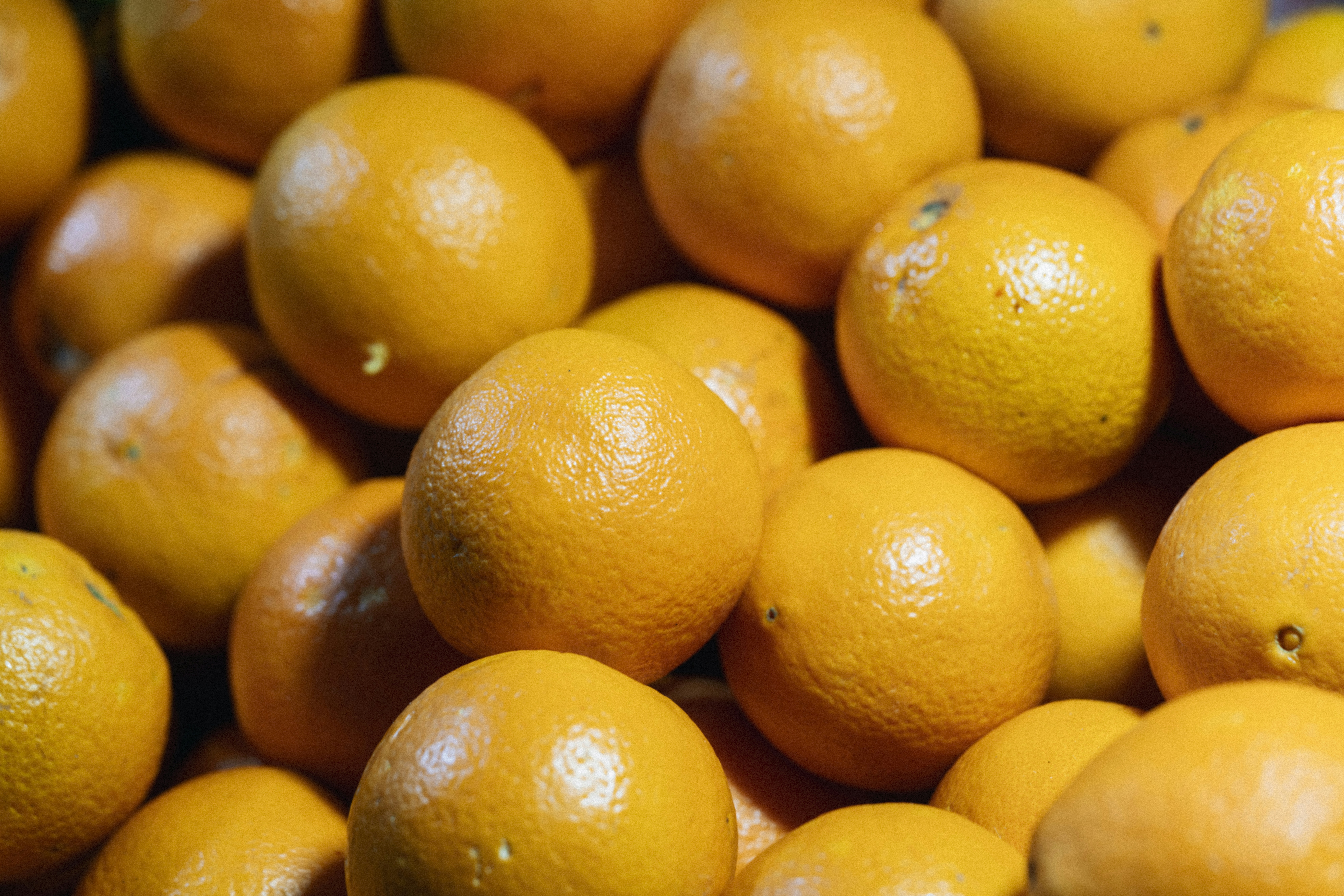 a pile of oranges sitting next to each other