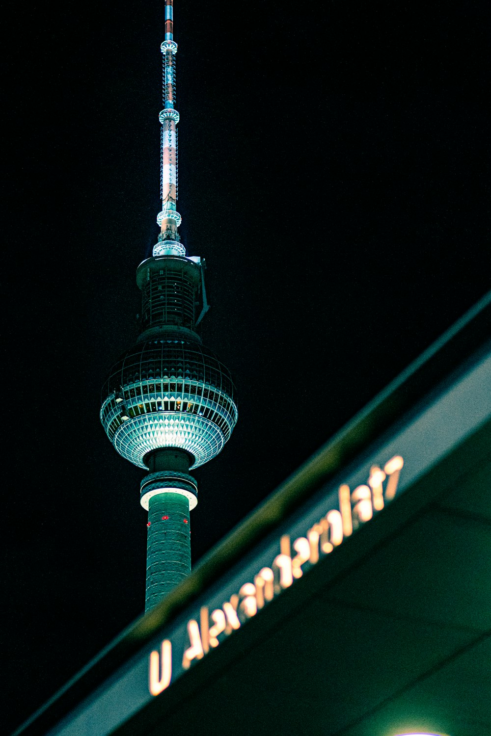 a view of a very tall building at night