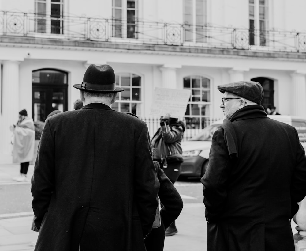 a couple of men standing next to each other