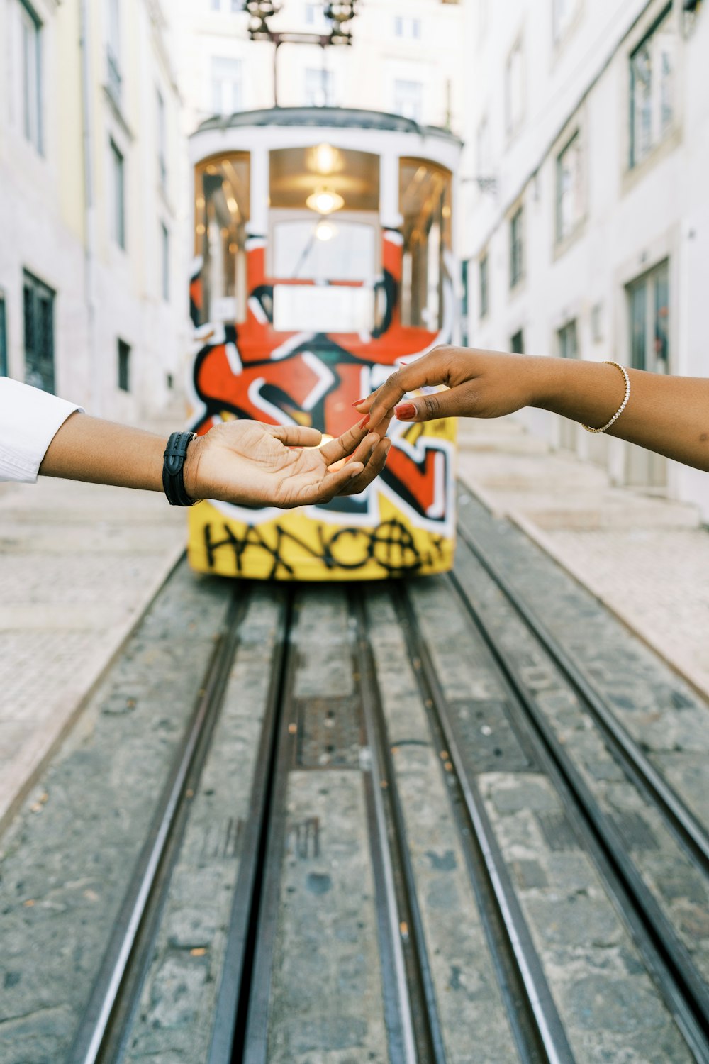 a couple of people reaching out to each other