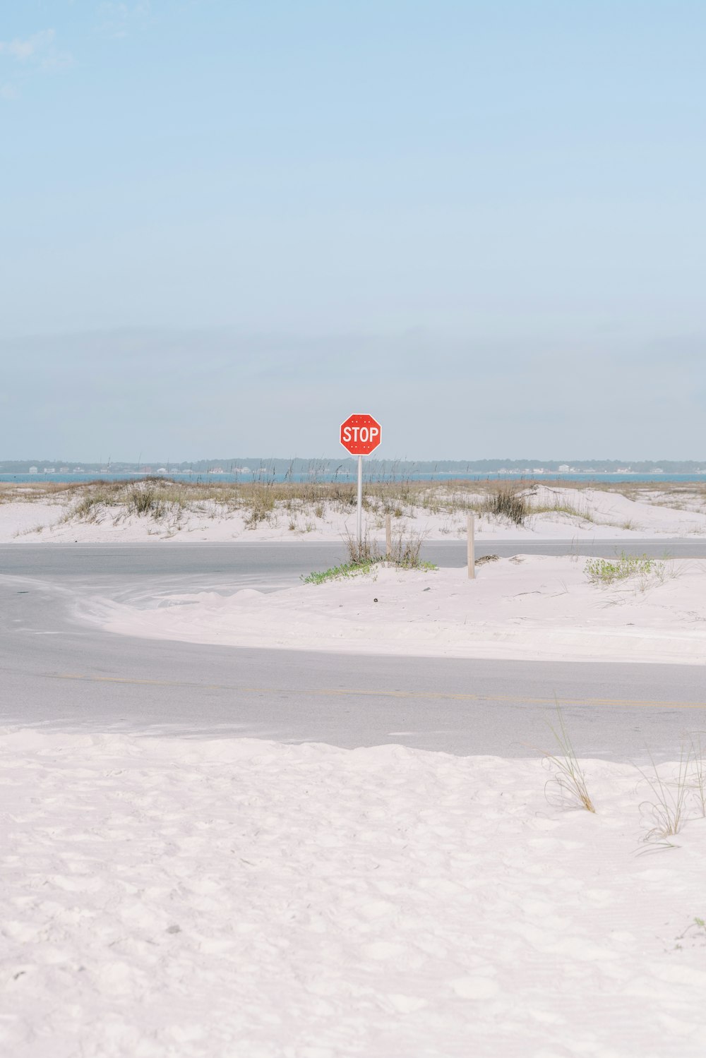 a red stop sign sitting on the side of a road