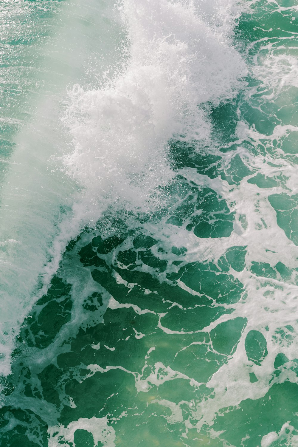 a person riding a surfboard on a wave in the ocean