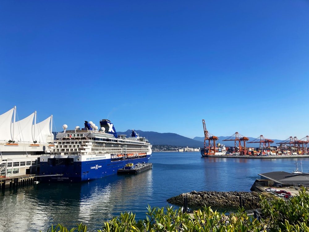 a large cruise ship docked in a harbor