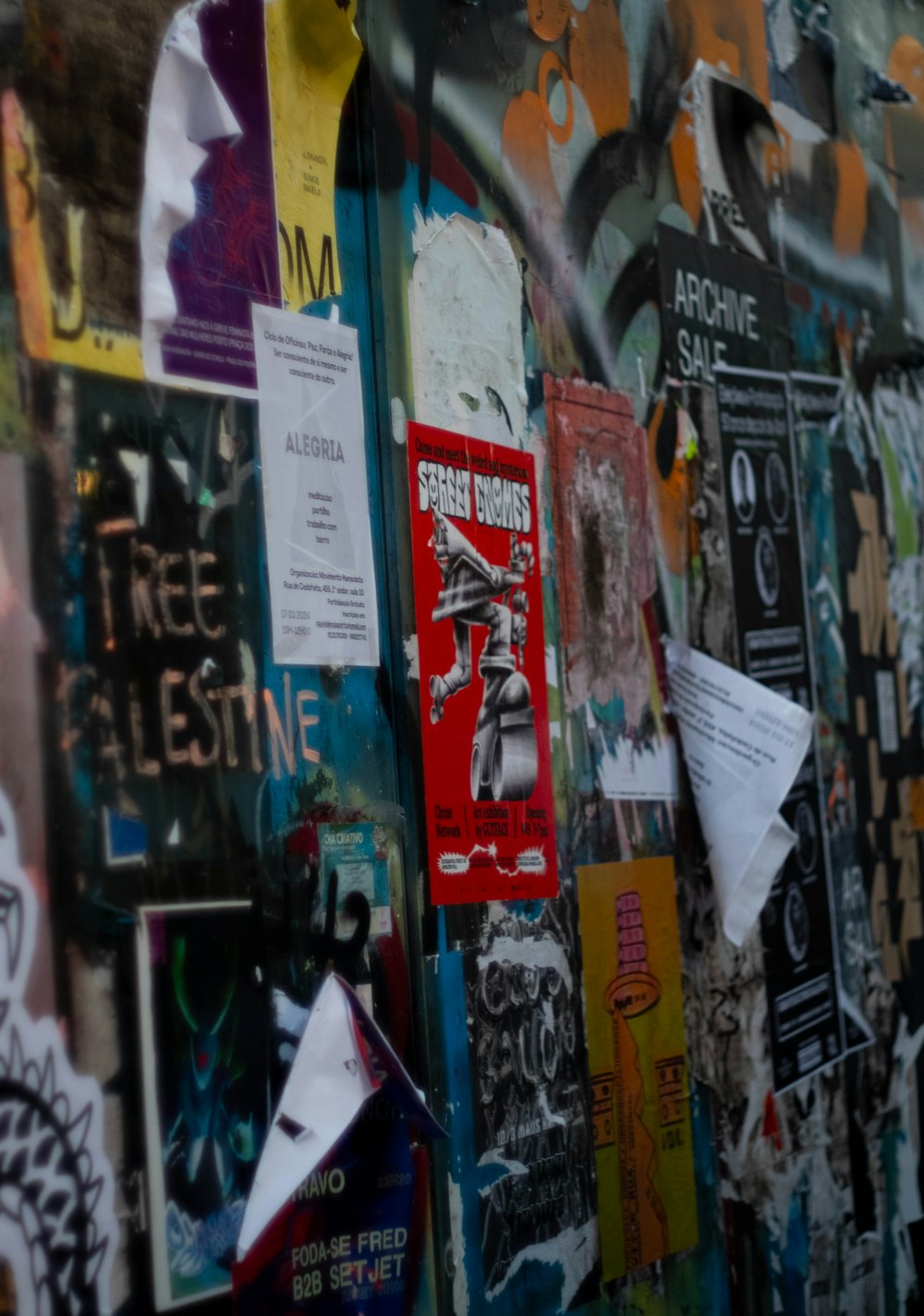 a wall covered in posters and papers