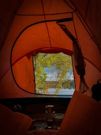 a view of a lake through a tent