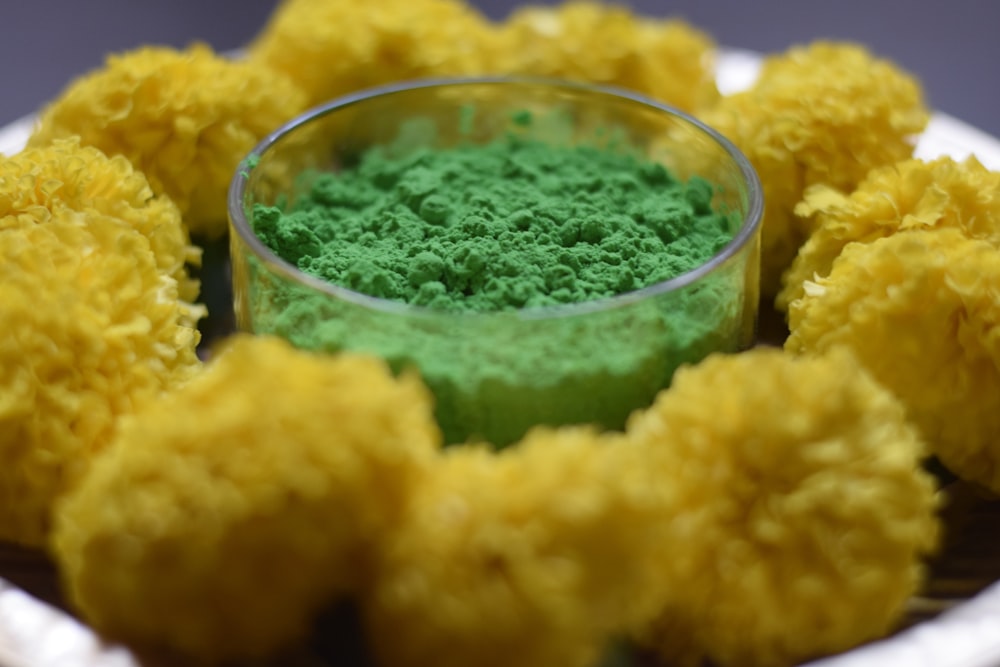 a white plate topped with yellow and green food