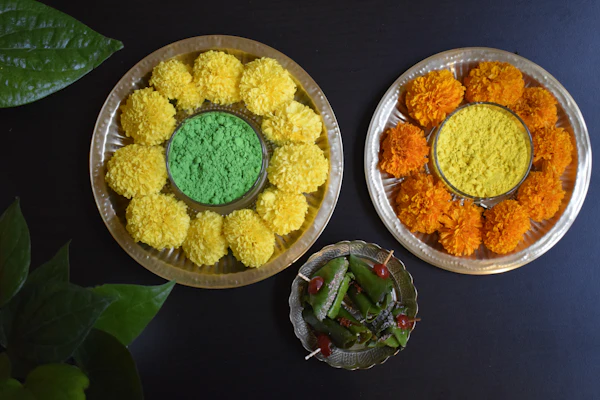 Thamboolam plates filled with different coloured pleated flowers