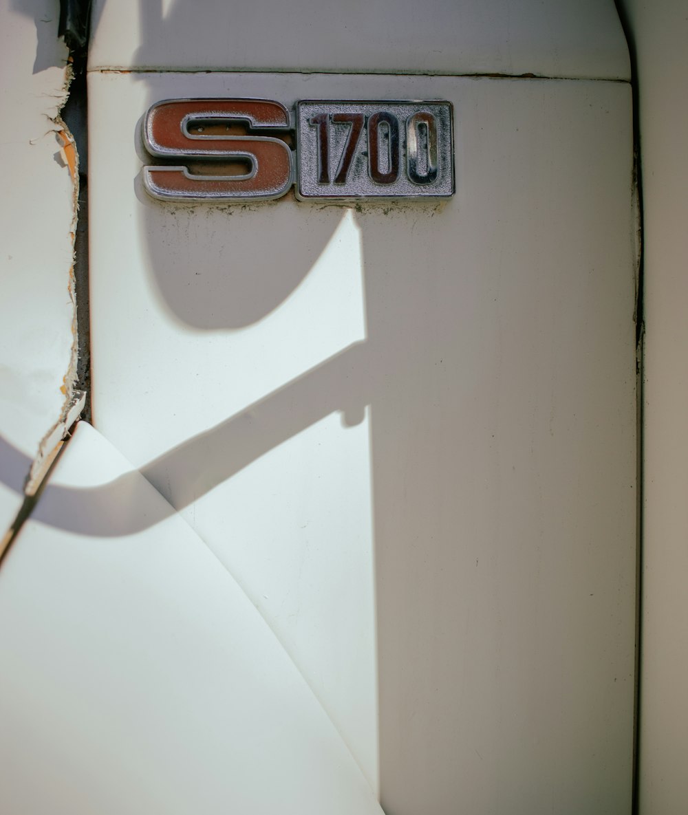 a close up of a license plate on a car