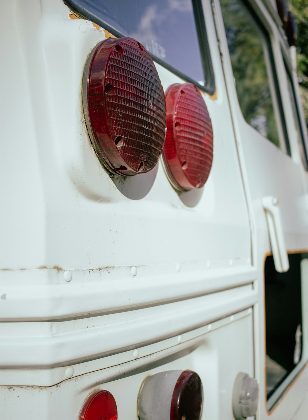 a close up of the tail lights of a white truck