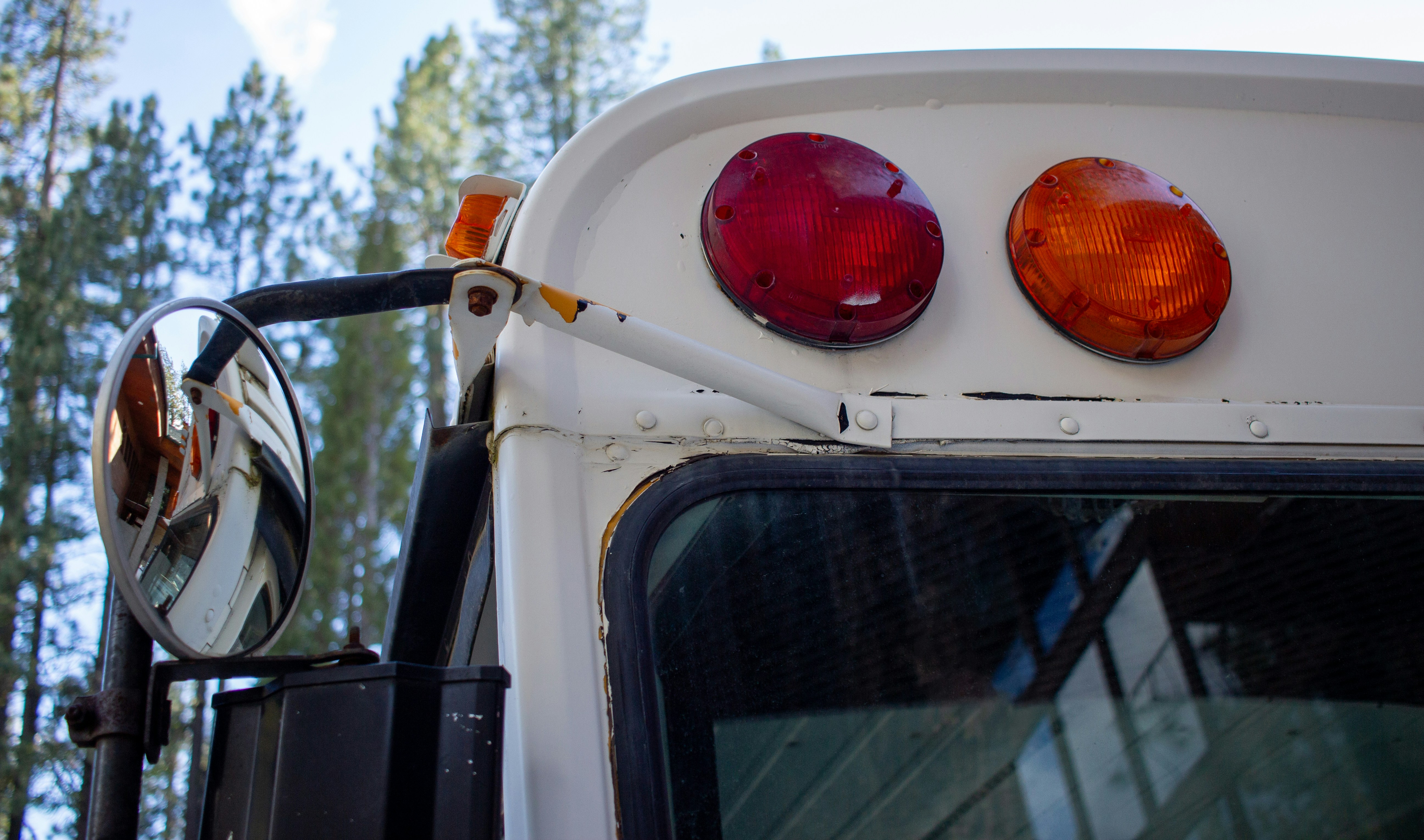 a close up of a white truck with its lights on