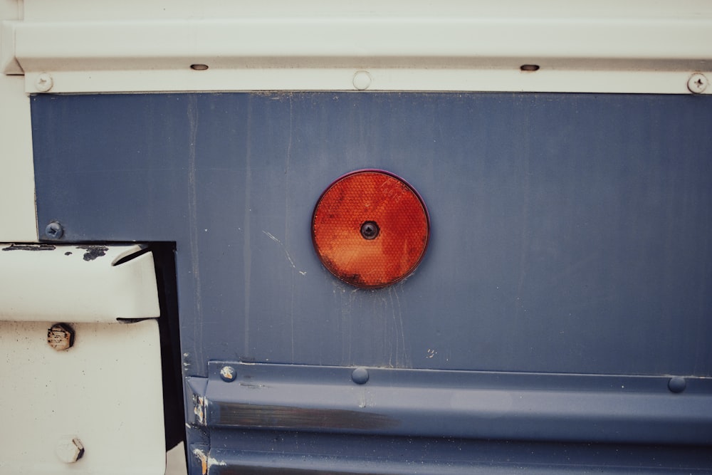 a close up of a metal object with a red circle on it