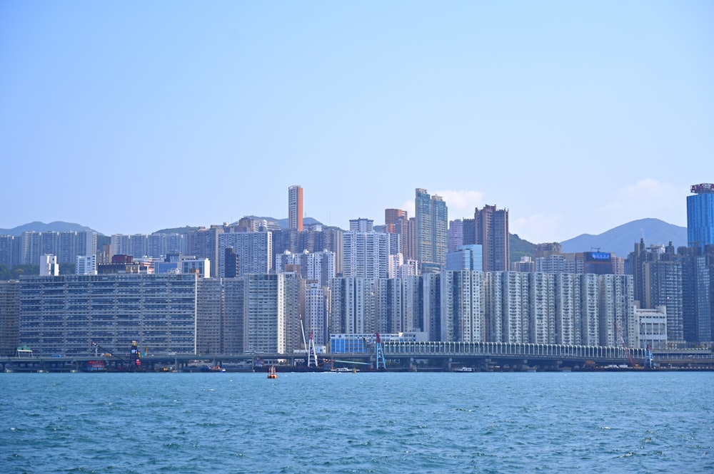 a large body of water with a city in the background