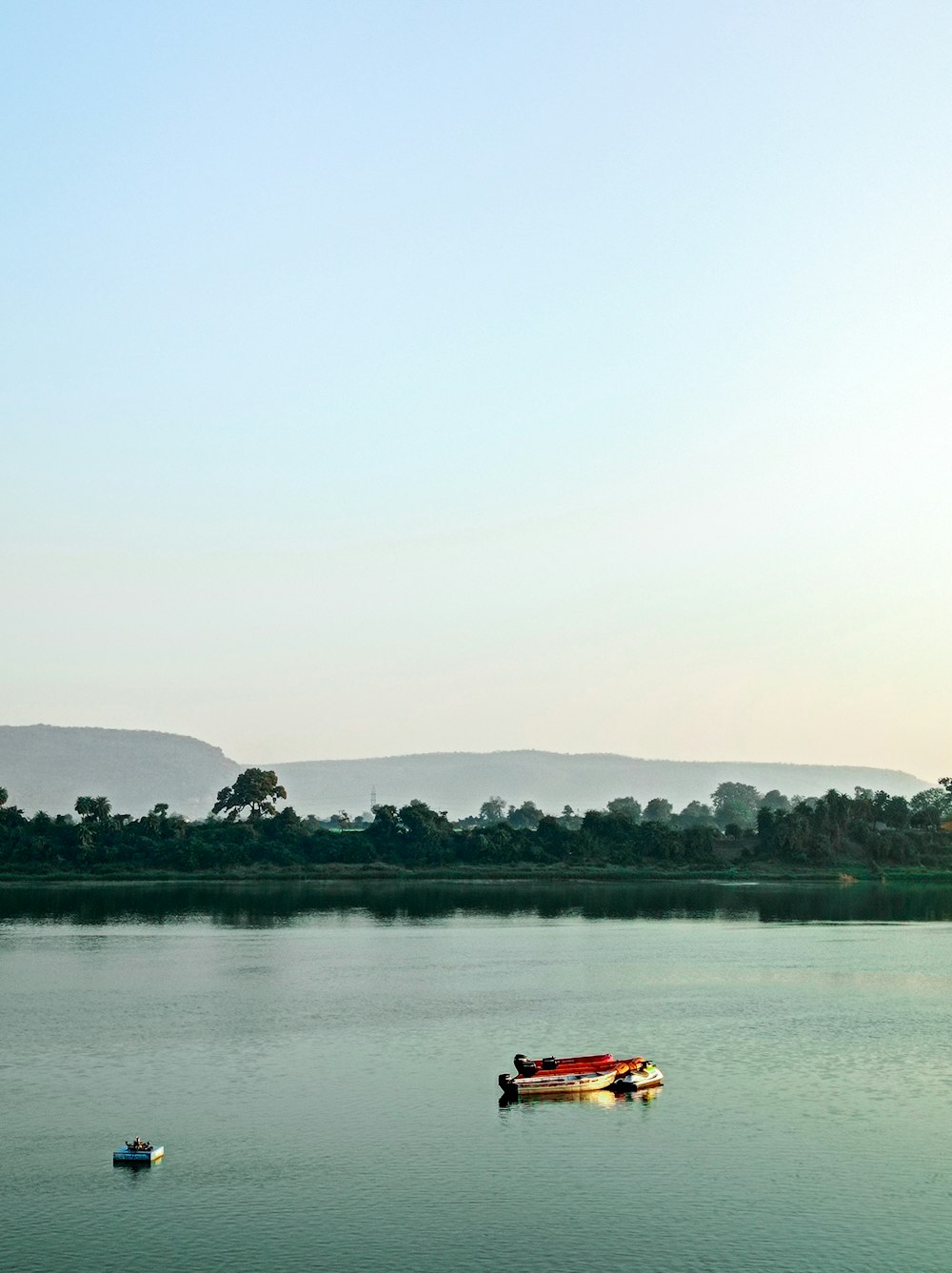 a body of water with boats floating on it