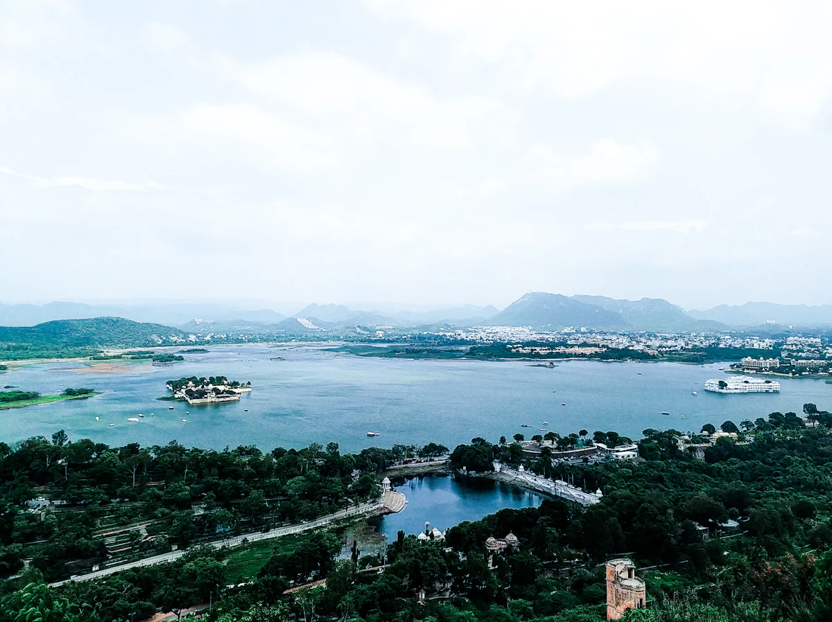 Lake Pichola seen from above, surrounded by trees