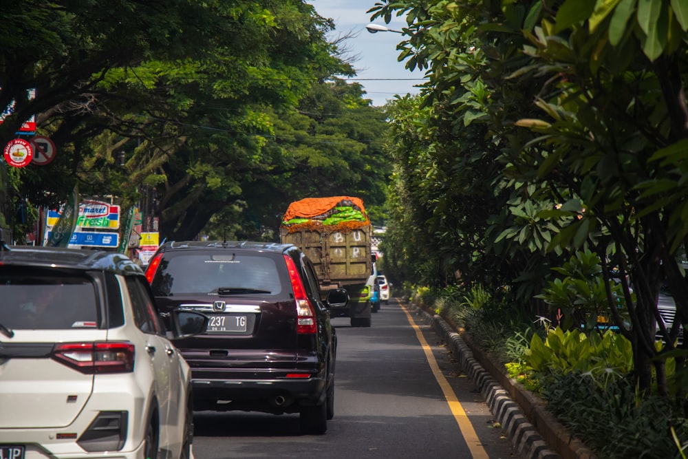 a street filled with lots of traffic next to trees